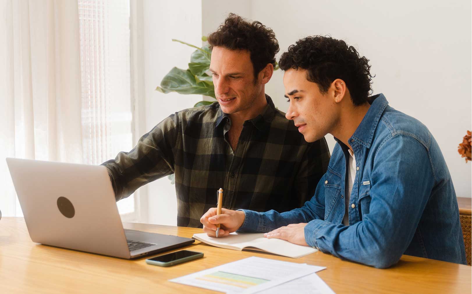 Two men working at a computer